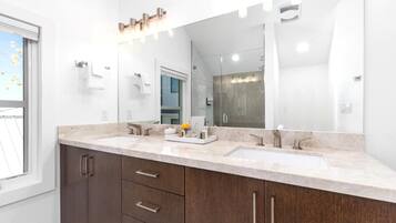 Shower, designer toiletries, towels, shampoo