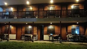 A two-story building with a flat roof and a balcony on each floor. - Julz El Nido Inn by Cocotel (El Nido)