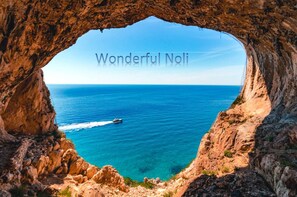 Experience the breathtaking view of the sea from this unique rock formation.