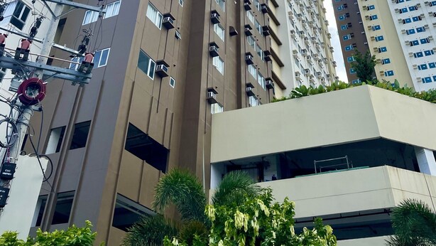 A high-rise building with multiple balconies and a modern architectural design. - Avida Aspira Condotel (Cagayan de Oro)