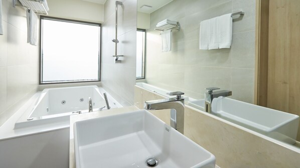 A modern bathroom with a large window, two sinks, and a bathtub. - Chuncheon Eston Hotel (Chuncheon)