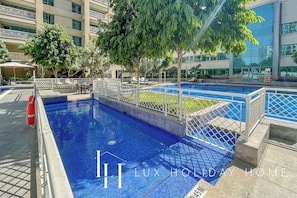 Outdoor pool, pool umbrellas, sun loungers
