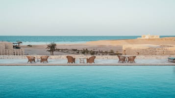 Outdoor pool, open 7:00 AM to 7:00 PM, pool umbrellas, sun loungers