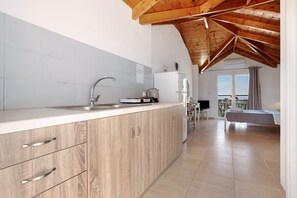 Fridge, stovetop, electric kettle, toaster