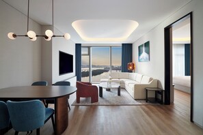 Premier Suite, 1 King Bed, River View | Living area | 55-inch Smart TV with cable channels, TV