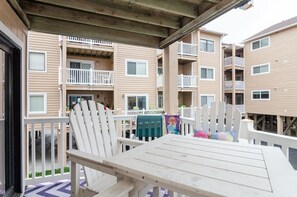 Guests can enjoy balconies with windows and outdoor dining areas.