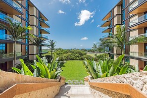 Enjoy a serene view of the lush garden from your balcony.