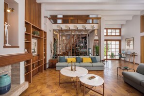 Family Villa | Living room | 65-inch Smart TV with satellite channels, TV, fireplace