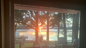 A view of a lake at sunset with a dock and chairs. - Lake Cabin with Fantastic View--Kayak, Swim or Fish (Perryville)