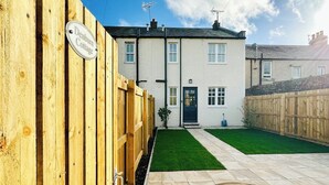 A two-story house with a sign reading "Denbigh Cottage." - 2 bedroom accommodation in Colinsburgh, near Elie and Anstruther (Colinsburgh, near Elie and Anstruther)