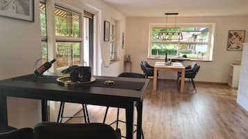 Deluxe Condo | Living area | 32-inch flat-screen TV with satellite channels, TV