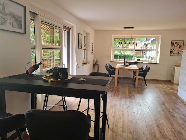 Deluxe Condo | Living area | 32-inch flat-screen TV with satellite channels, TV