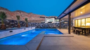 A modern outdoor pool area with a clear view of the mountains in the background. - The Gambit Luxury Zion Home Pool Hot Tub Sleeps 14 (Hurricane)