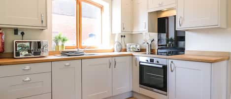 Fridge, dishwasher, electric kettle, cookware/dishes/utensils