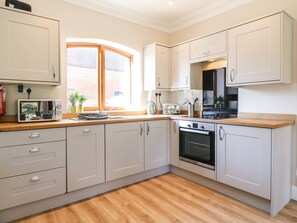 Fridge, dishwasher, electric kettle, cookware/dishes/utensils