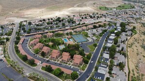 An aerial view of a residential area with houses, roads, and a sports complex. - Beautiful 3 bedroom Sports Village Condo--sleeps 10. (St. George)