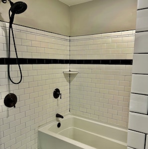 Combined shower/tub, hair dryer, towels, soap