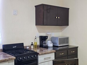 Fridge, microwave, coffee/tea maker, toaster