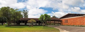 A building with a brick facade and a covered walkway.