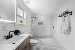 Bathtub, hair dryer, towels, soap