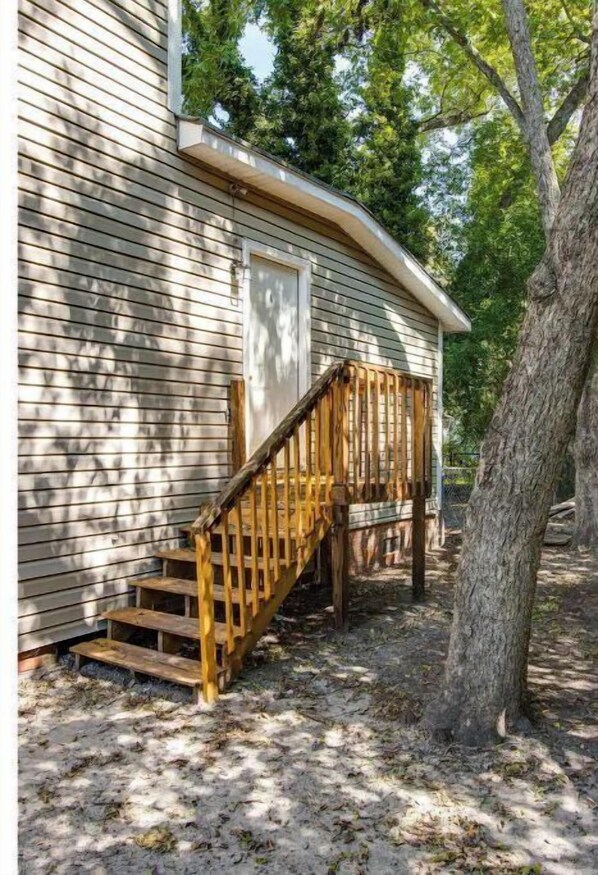 Step up to a cozy cabin nestled among the trees.