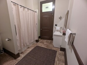 Combined shower/tub, hair dryer, towels, soap