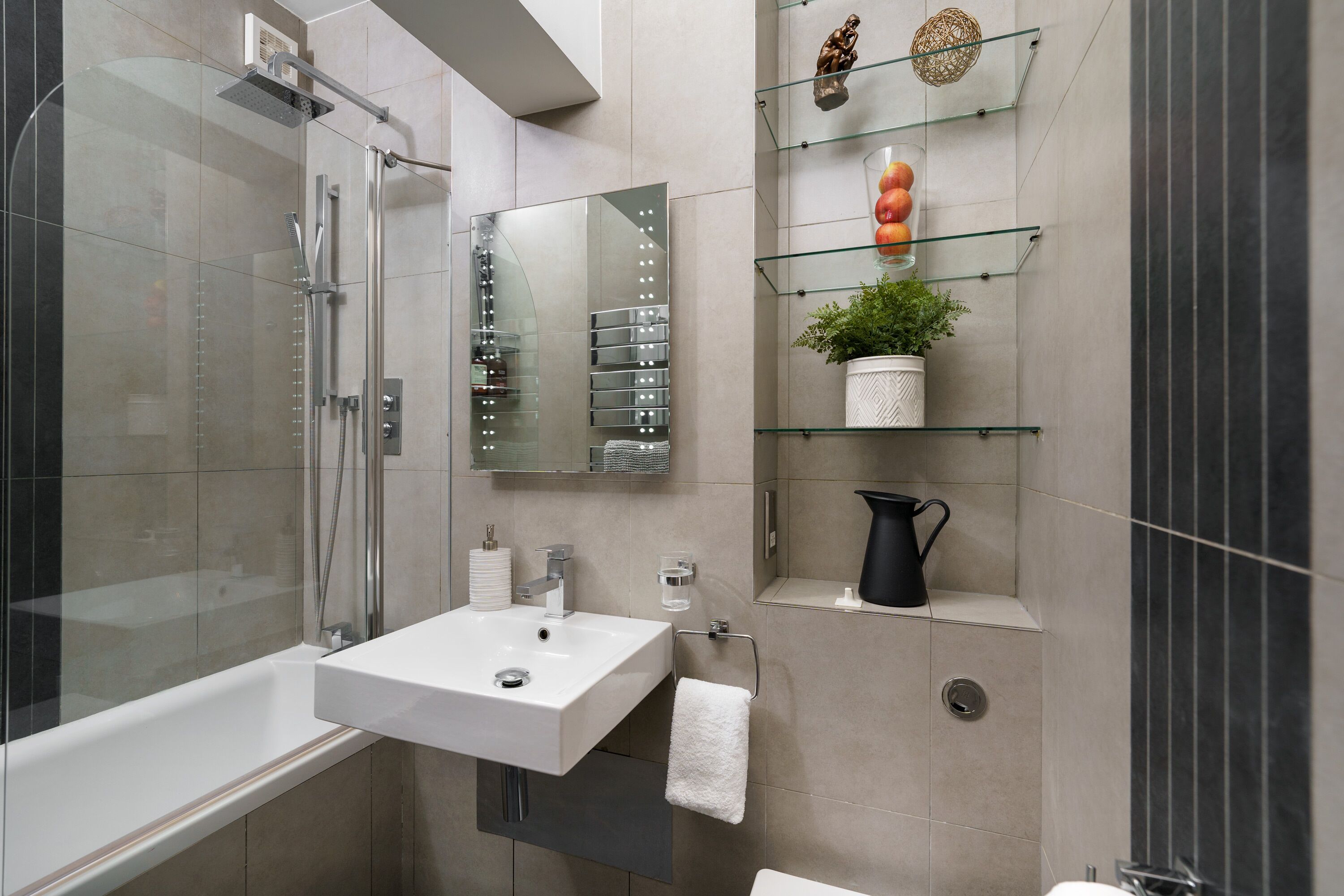Bathtub, hair dryer, towels, soap
