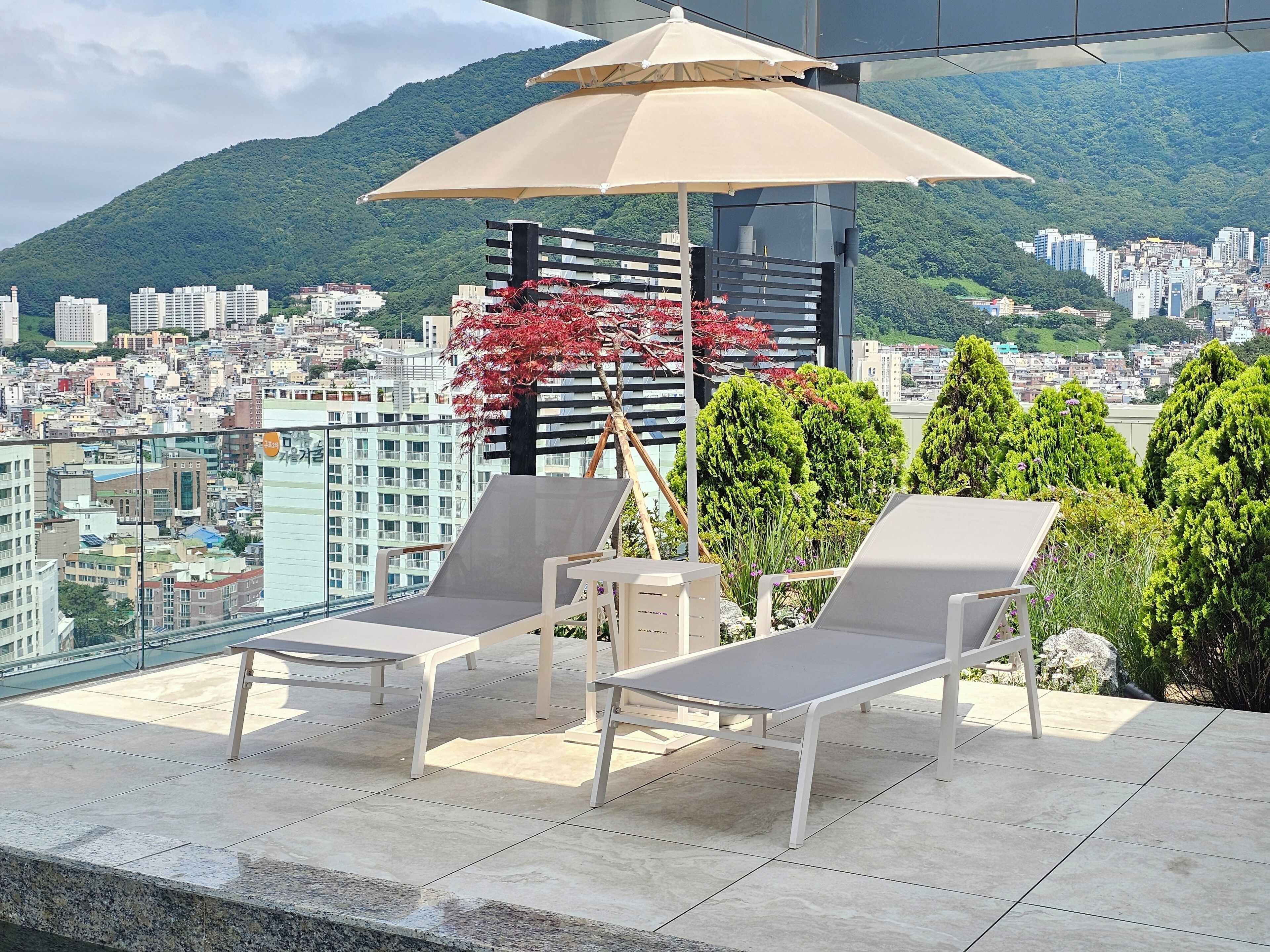 Outdoor pool, open 10:00 AM to 10:00 PM, pool umbrellas
