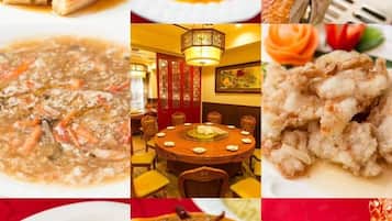 A variety of dishes including seafood, vegetables, and a traditional setting with a round table and chairs.