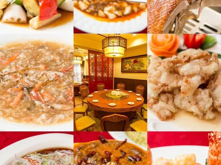 A variety of dishes including seafood, vegetables, and a traditional setting with a round table and chairs.