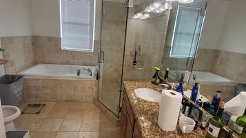 Bathtub, hair dryer, towels, soap