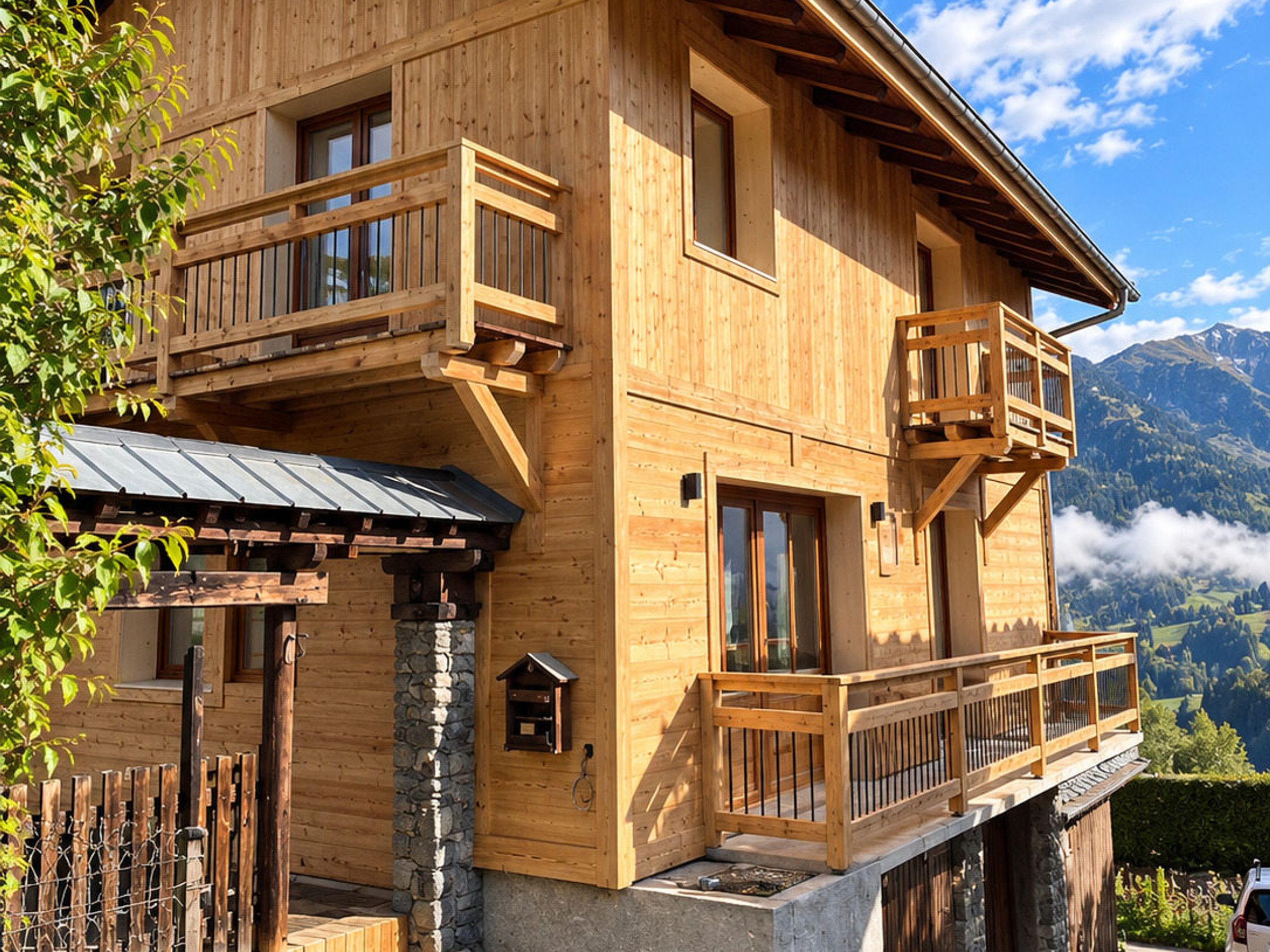 A wooden chalet with balconies, stone foundation, and a mountain view.