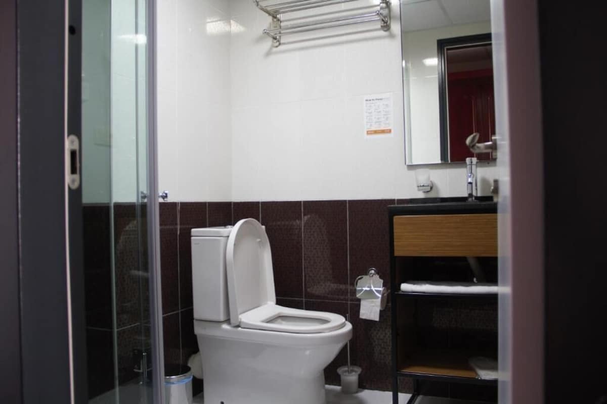 Bathroom | Shower, rainfall showerhead, hair dryer, bathrobes