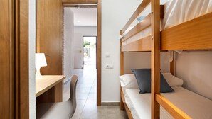 A room with bunk beds, a desk, and a chair. - Pet-Friendly Holiday Home "Villa Montenmedio - Carmelo" with Mountain View & Pool (El Soto)