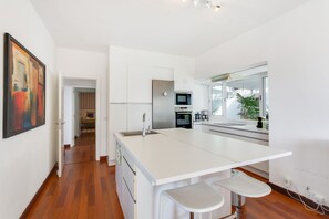 Private kitchen - Vacation Home "Villa Bahía de Michel" with Sea View, Pool, Garden & Wi-Fi (santa ursula)