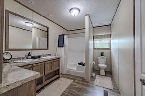 Combined shower/tub, hair dryer, towels, soap