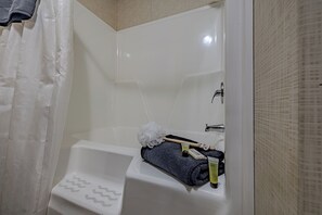 Combined shower/tub, hair dryer, towels, soap