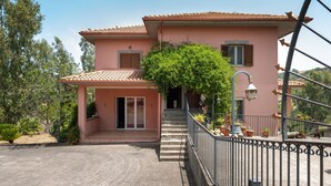 A two-story house with a balcony, a staircase, and a garden. - Villa "Filippa" with Mountain View, Private Terrace & Private Garden (Nicosia)