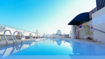 Outdoor pool, open 7:00 AM to 11:00 PM, sun loungers, lifeguards on site