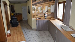 A kitchen with a wooden counter, a sink, and a window. - Theis-Mühle (Biersdorf am See)