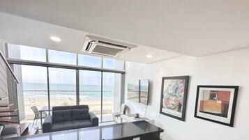 Exclusive Apartment | Living area | 50-inch LED TV with digital channels, TV