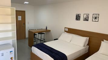 Basic Triple Room, Multiple Beds, City View | Desk, laptop workspace, free WiFi, bed sheets