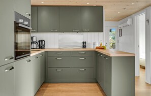 Fridge, stovetop, dishwasher, coffee/tea maker