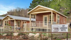 A wooden building with a porch and a sign that reads 'MT LEMMON HOTEL.' - Mt Lemmon Hotel Summerhaven Pet Friendly Cabin 15 (Mount Lemmon)