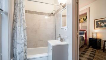 Combined shower/bathtub, hair dryer, towels, soap