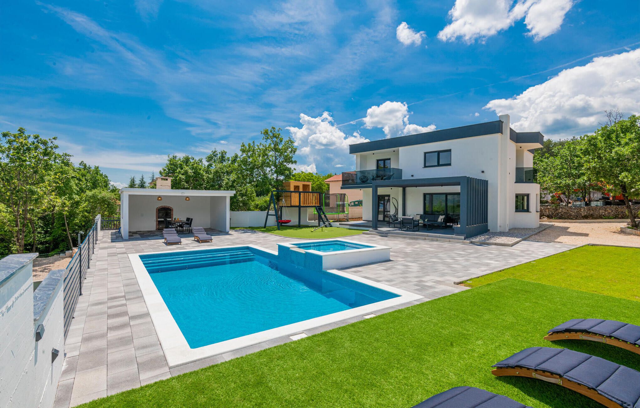 Outdoor pool, a heated pool, pool loungers