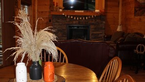A wooden dining table with three vases and a candle holder. - 2 Acres of pure paradise with amazing Mountain View’s!! Minutes from Emory&Henry (Meadowview)