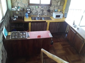 Fridge, microwave, cookware/dishes/utensils, dining tables