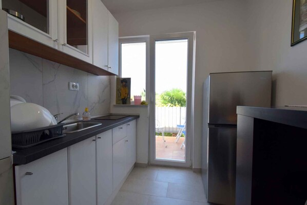 Fridge, stovetop, cookware/dishes/utensils