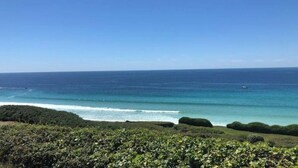 A coastal landscape with a view of the ocean and a distant boat. - Audierne/Plouhinec: 1 km from the sea, in a peaceful, enclosed setting. (Plouhinec)